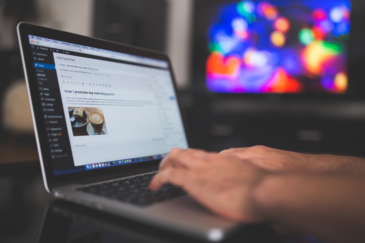 A robot hand typing on a laptop with WordPress logo on screen, symbolizing automated content publishing for SEO success.