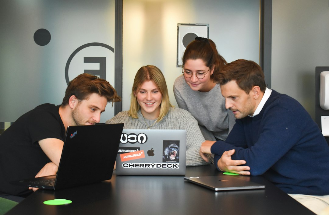 Creative team collaborating with automated content workflow visual overlay on a dashboard.