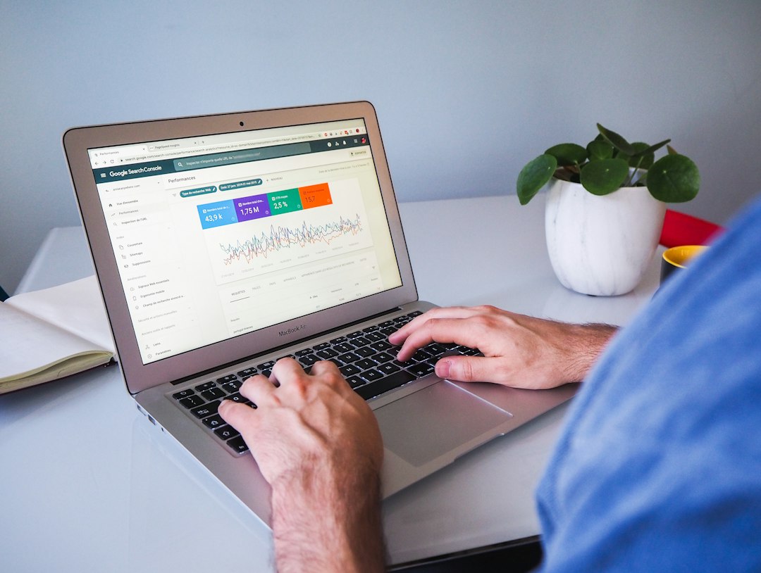 A robot analyzes data with charts and graphs in the background, symbolizing AI SEO.